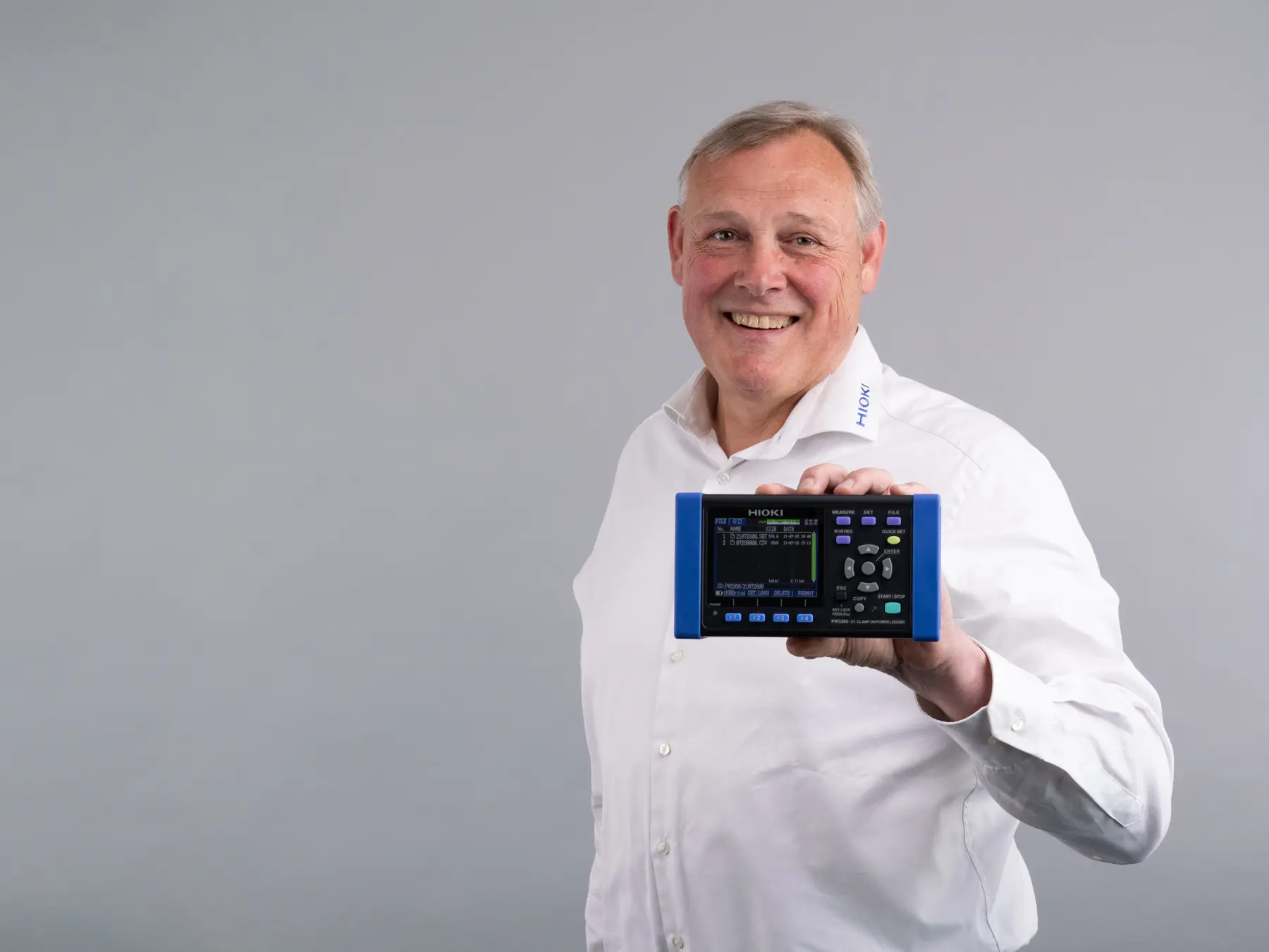 HIOKI PW3360-21 clamp on power logger 3phase 4wire white male holding